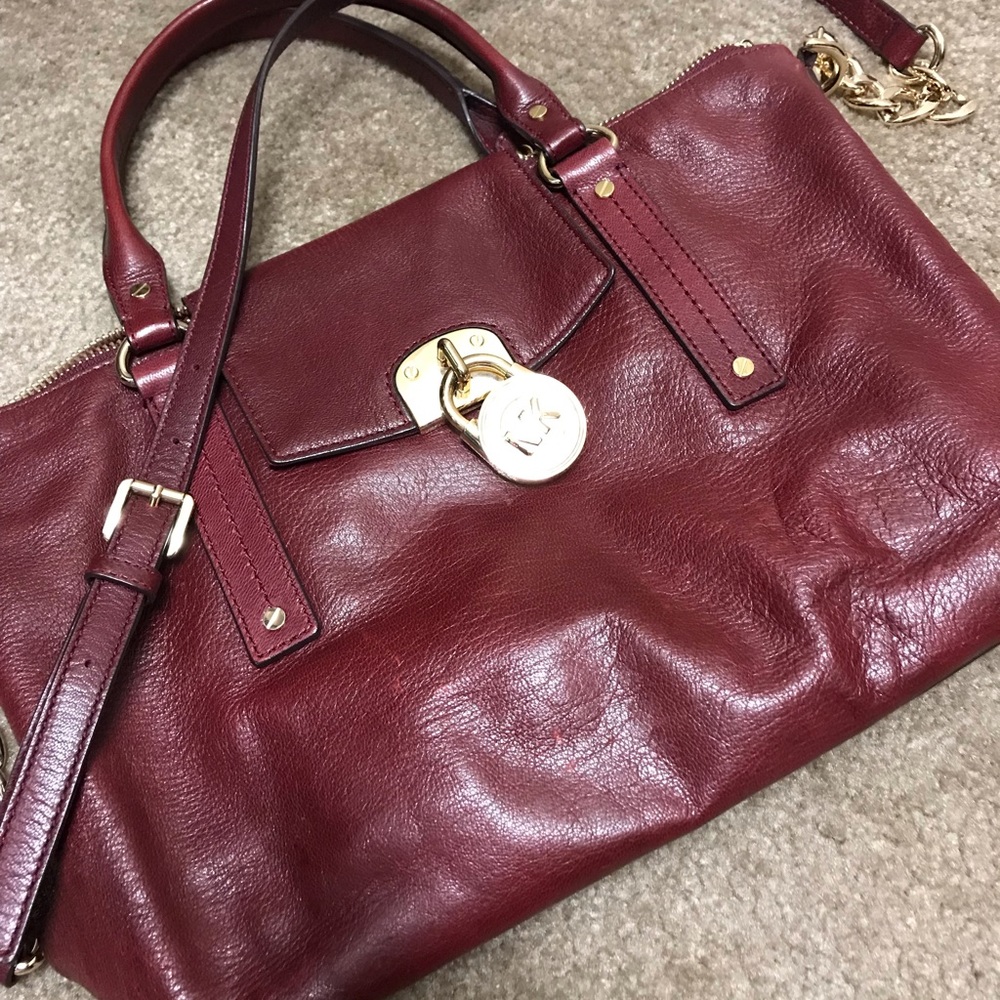 Michael Kors maroon satchel with crossbody strap